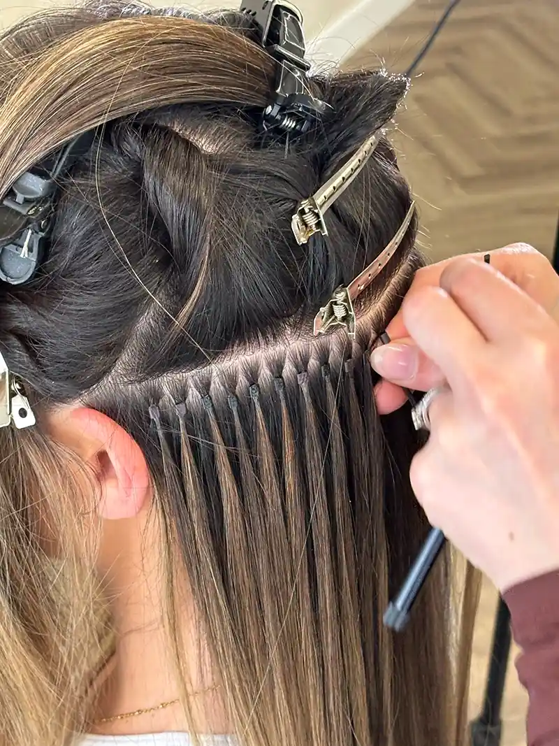 Micro ring hair extensions technique close-up
