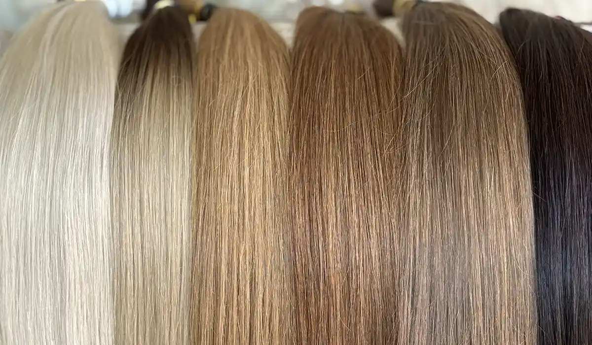 A palette of multi-tonal hair extensions demonstrating complex shades.