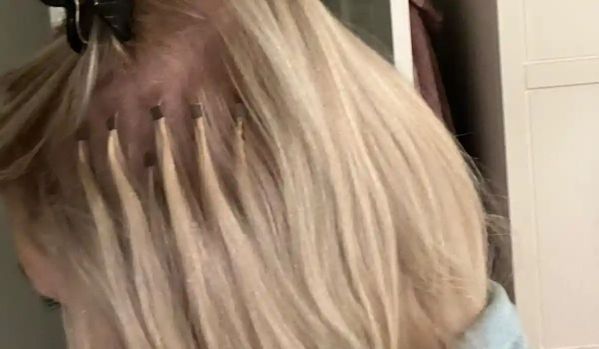 Carly's hair with unsuitable extensions, showing damage or unnatural look.
